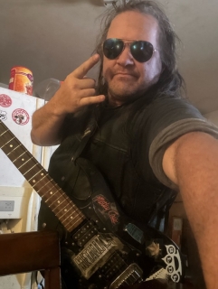 I am a musician. I write lyrics and then I play guitar and I sing and I work on TikTok in YouTube